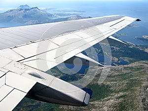Norwegian landscape under aeroplane wing