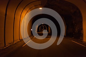 Norwegian long dark tunnel inside view. Norway, inside to the subsea two-lane road tunnel