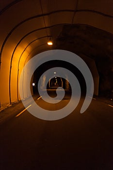 Norwegian long dark tunnel inside view. Norway, inside to the subsea two-lane road tunnel