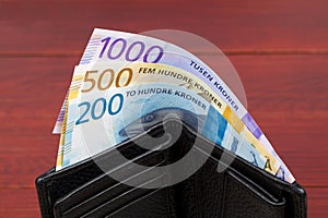 Norwegian krone in the black wallet