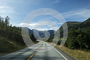 Norwegian mountain road with Josteldalsbreen glacier in the background