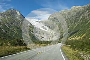 Norwegian mountain road with Josteldalsbreen glacier in the background