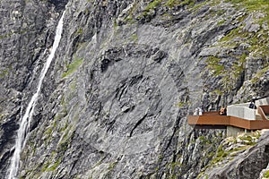 Norwegian mountain tourist landscape. Stigfossen waterfall and v