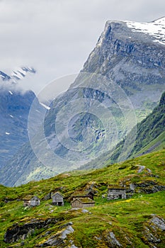 Norwegian mountain village with traditional turf roof houses, Geiranger, Sunnmore region, More og Romsdal county, Norway