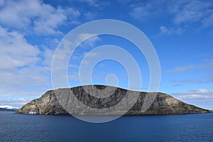 Norwegian mountains seen from the sea. Above the Arctic Circle.