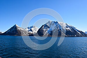 Norwegian mountains seen from the sea. Above the Arctic Circle.