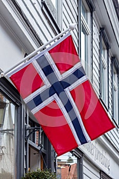 Norwegian National Flag Hanging On Poles Outside A Building