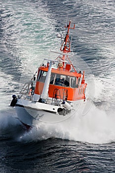 Pilot boat rushing through waves, Norway - Scandinavia photo