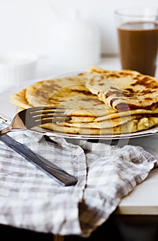 Norwegian potato pancakes Lefse in a white plate  on table.