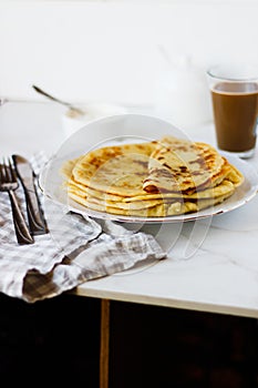 Norwegian potato pancakes Lefse in a white plate  on table.