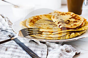 Norwegian potato pancakes Lefse in a white plate  on table.