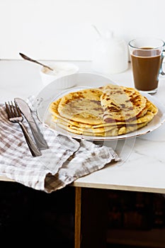 Norwegian potato pancakes Lefse in a white plate  on table.