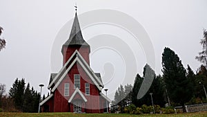 Norwegian red church Hol kyrkje at Hagafoss in Buskerud Norway in autumn photo