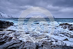 Norwegian Sea waves on rocky coast of Lofoten islands, Norway