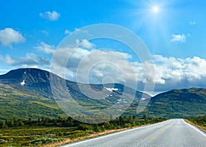 Norwegian sunshiny summer road near Dombas, Norge photo