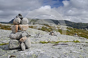 Norwegian tundra with cairns and rocky hills