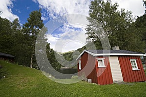 Norwegian wooden hut, lakeside