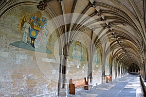 NORWICH, UK - JUNE 5, 2017: The Cloister in Norwich Cathedral with paintings, vaults and sculpted bosses in the ceiling