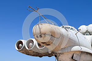 Nose, cockpit and engines of Lun-class Ekranoplan floatplane - unique soviet weaponry against blue sky
