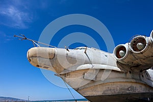Nose, cockpit and engines of Lun-class Ekranoplan floatplane - unique soviet weaponry against blue sky