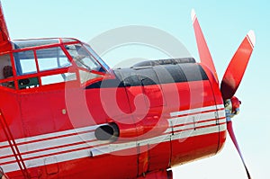 Nose of a large red airplane