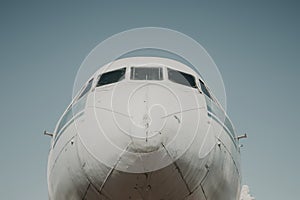 The nose of the plane against the blue sky.