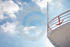 The nose of the pleasure craft against the blue sky