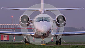 Nose view of Cessna Sovereign aircraft at the airport ramp photo