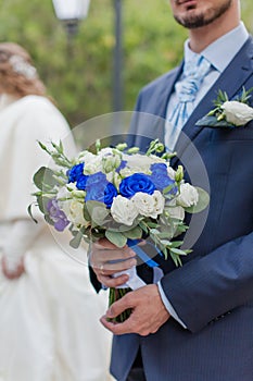 Nosegay in hands of bridegroom