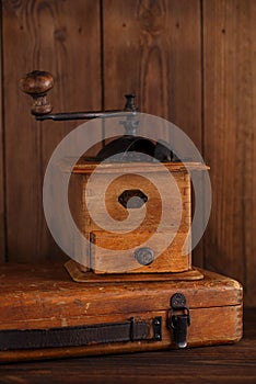 Nostalgic coffee grinder on old stool