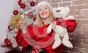 Nostalgic moments. Melancholy emotions. Merry christmas and new year. Lonely woman with teddy bear toy and champagne