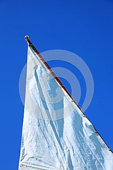 Nostalgic sail in blue sky, lake in austria in summer