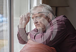 Nosy neighbor looking at something out of his window