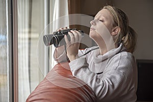 Nosy neighbor spying through window