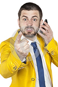 Not happy businessman talking on the phone and threatens finger