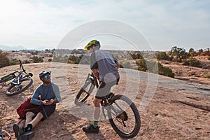 Not just a hobby, its a lifestyle. Full length shot of two athletic men taking a break while mountain biking through the