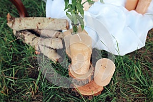 Not lighted candles on logs. Wedding decoration