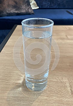 Not So New Glass Full Of Water on Brown Bar Table