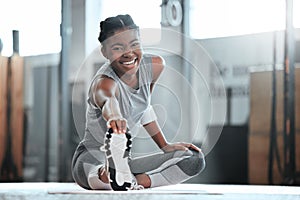 Not scorned or covered in scars. Portrait of a young beautiful woman doing stretches and exercising at the gym.