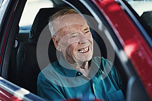 Not slowing down anytime soon. Cropped shot of a senior man driving his car.