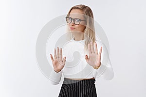 Not think so. Displeased and disgusted intense businesswoman in glasses move back turning away from dislike and aversion