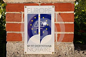 Notaire europe flag french plate sign logo in wall building office european notary in france photo