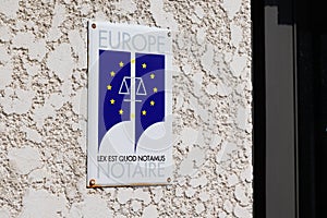 Notaire europe plate sign text and brand european logo in wall building office for photo