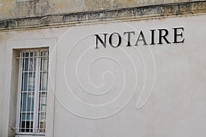 Notaire french text sign means office entrance notary in building agency photo