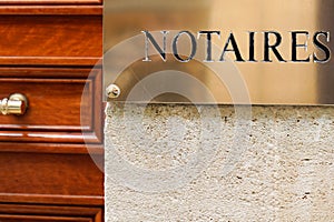 Notaire golden french sign gold logo notary office building wall , notaires means notaries photo