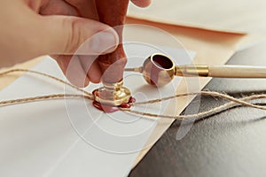 Notarial wax seal on tied scrolled documents, closeup