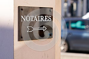 Notary arrow board sign logo entrance building office for french Notaire photo