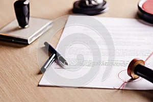 Notary pen lying on testament.