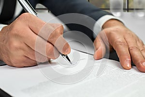 Notary's hands doing daytime paperwork.