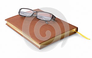 Note-book and glasses